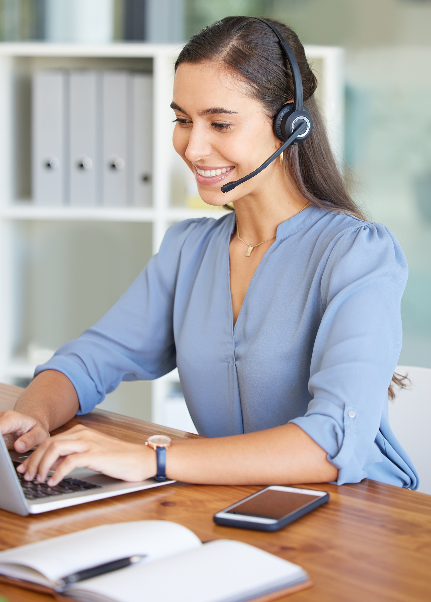 Telemarketing, call center and woman typing on laptop for technical support, crm consulting and hel